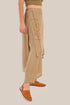 Pants with an embroidered asymmetric skirt
